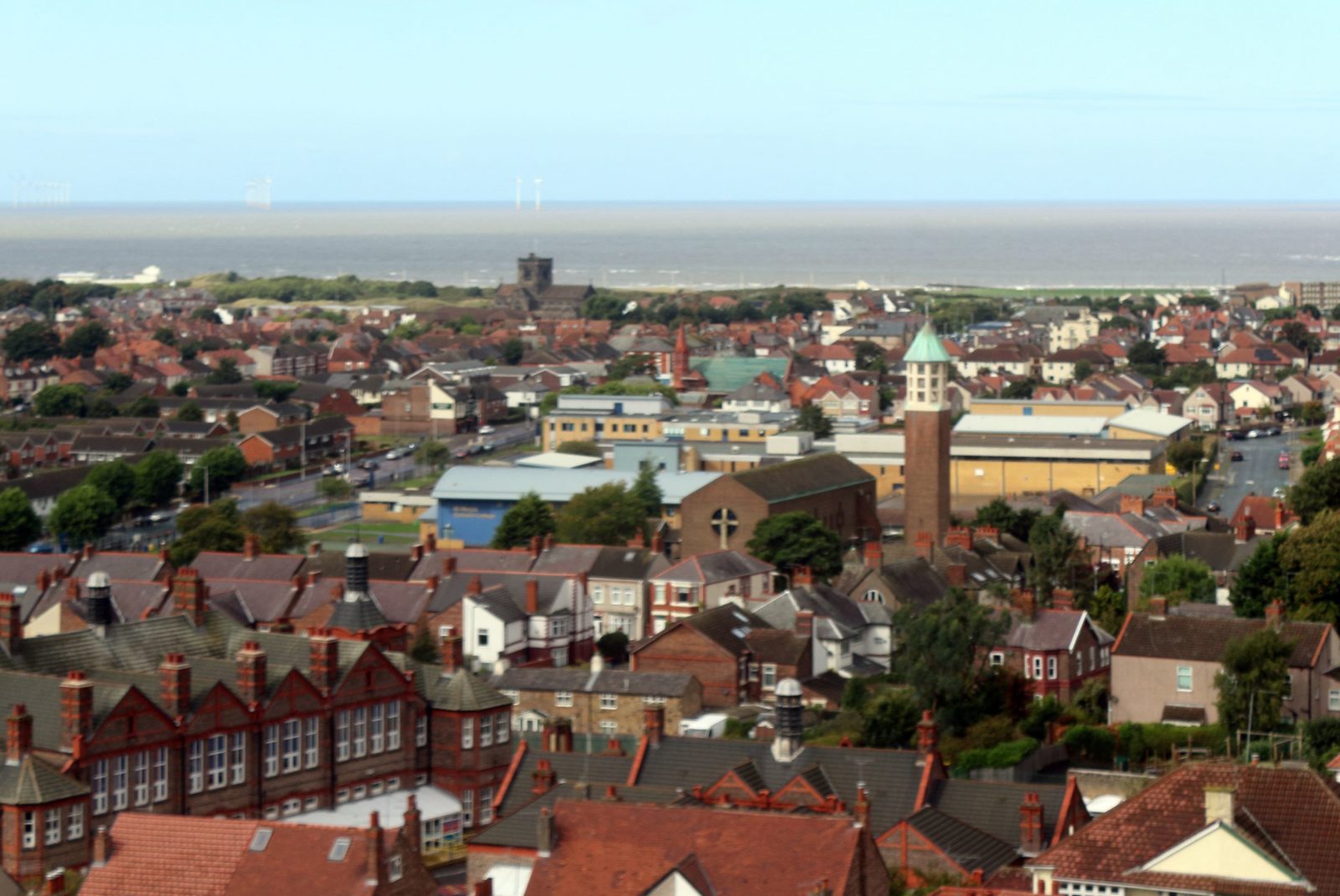 Panoramic view of part of Wallasey village, looking towards the coast. Photo: Rodhullandemu, Roofscape to Wallasey Village, CC BY-SA 4.0
