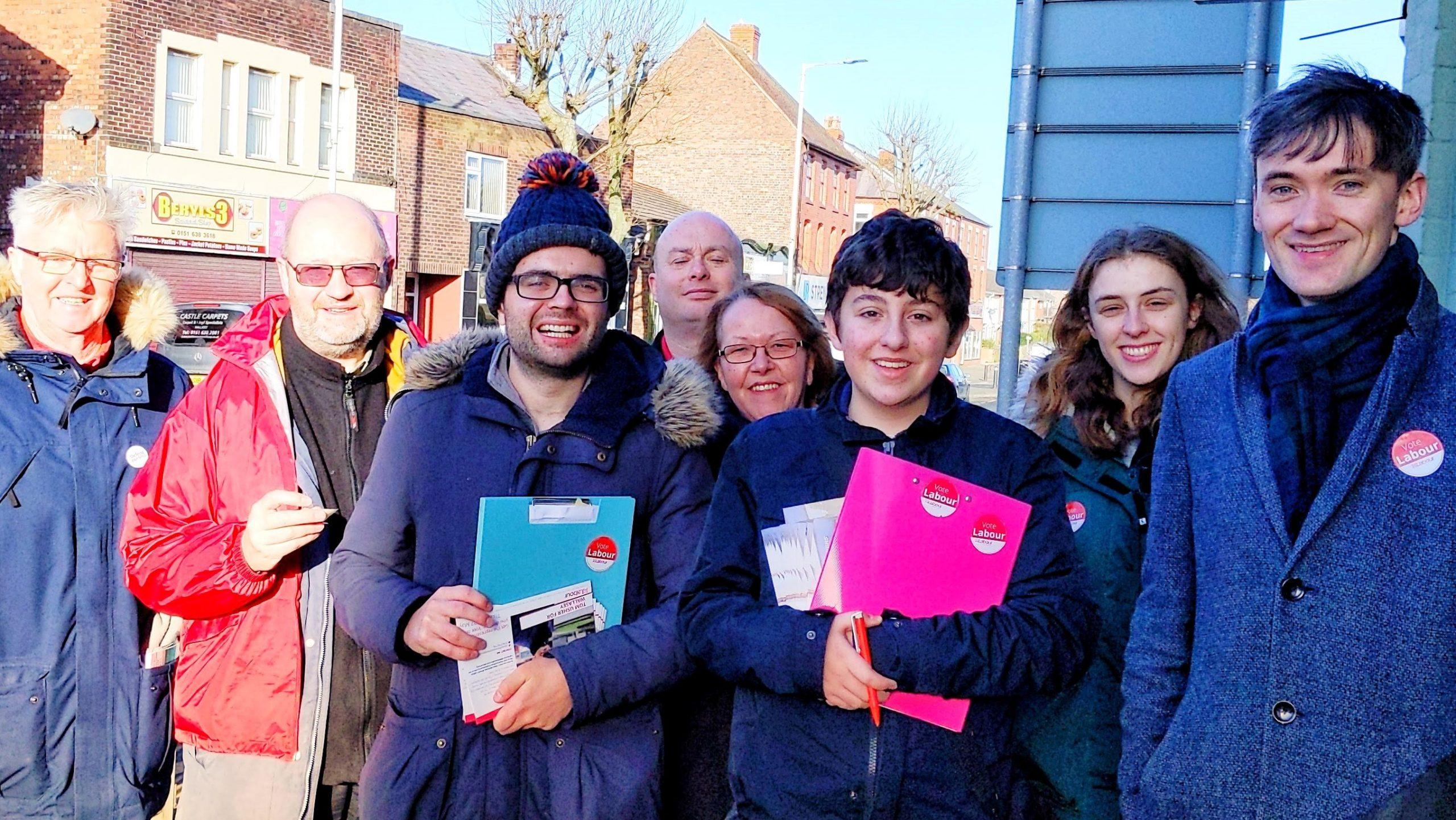 A group shot of party members about to start canvassing with Wallasey village in the background. 